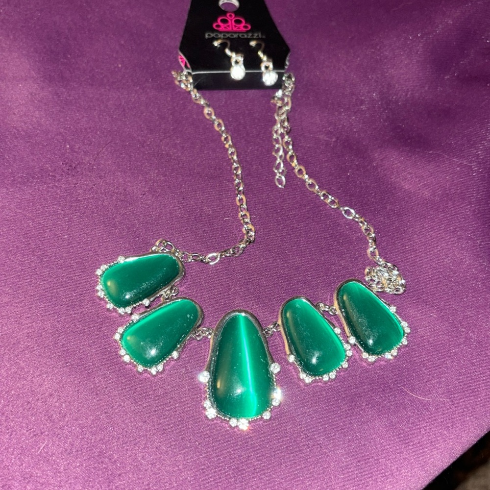 Paparazzi earring and necklace set with diamond looking details and a green gems